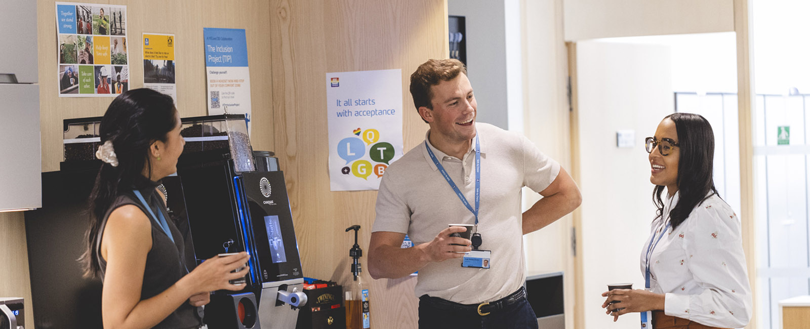 Three Yara employees chatting by coffee machine